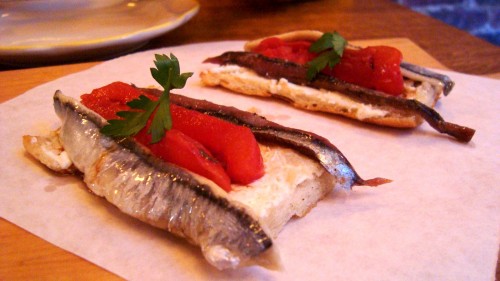 Tosta Matrimonio - black and white anchovies, slow-roasted tomato, sheep's milk cheese, aged balsamic