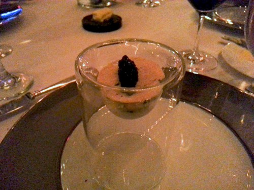 Caviar and hamachi in a tall glass bowl.